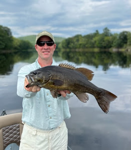 A lone angler fishing in Auburn, Maine