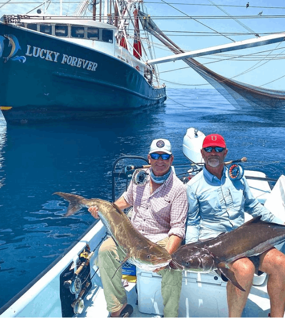 Two anglers fishing in the waters of Port O'Connor