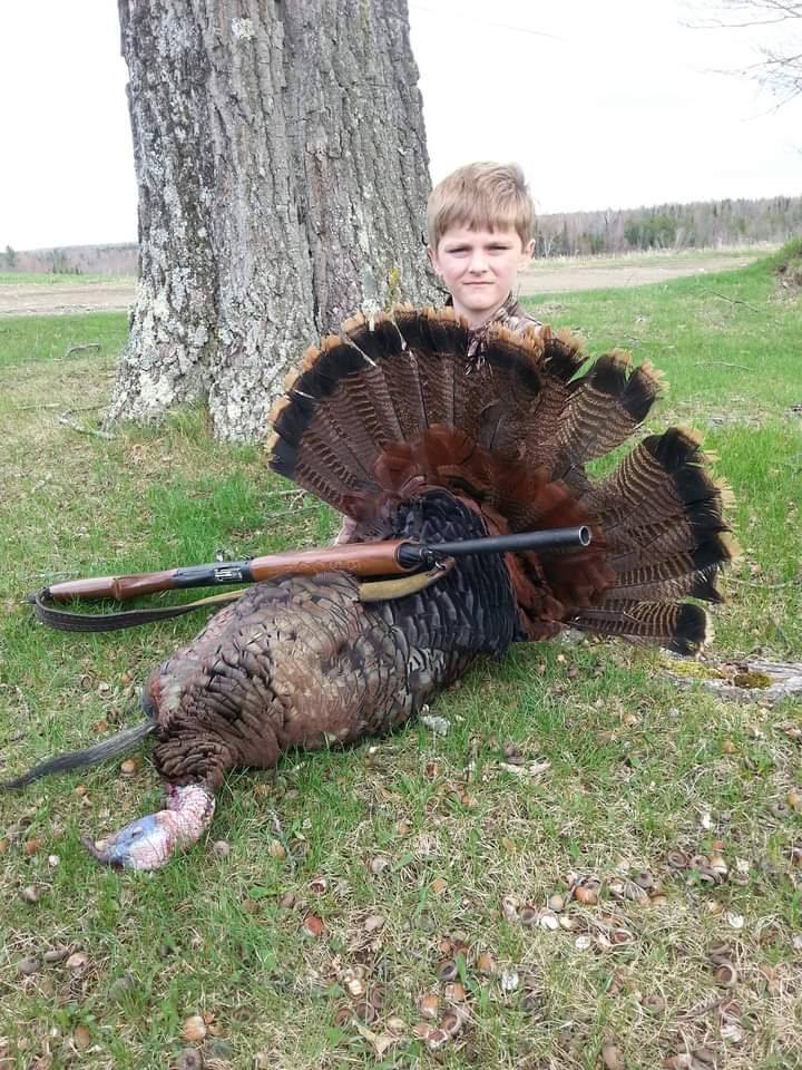 Turkey hunting success in Palmyra ME with rifle and harvested bird displayed
