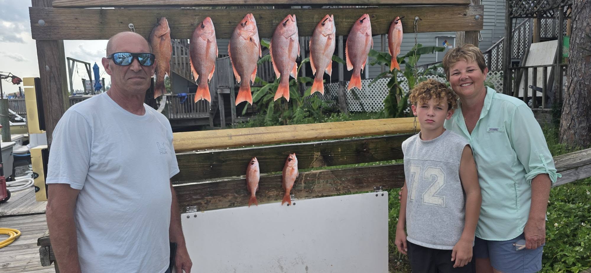 Red snapper and grey snapper fishing catch displayed on cleaning station in Destin FL