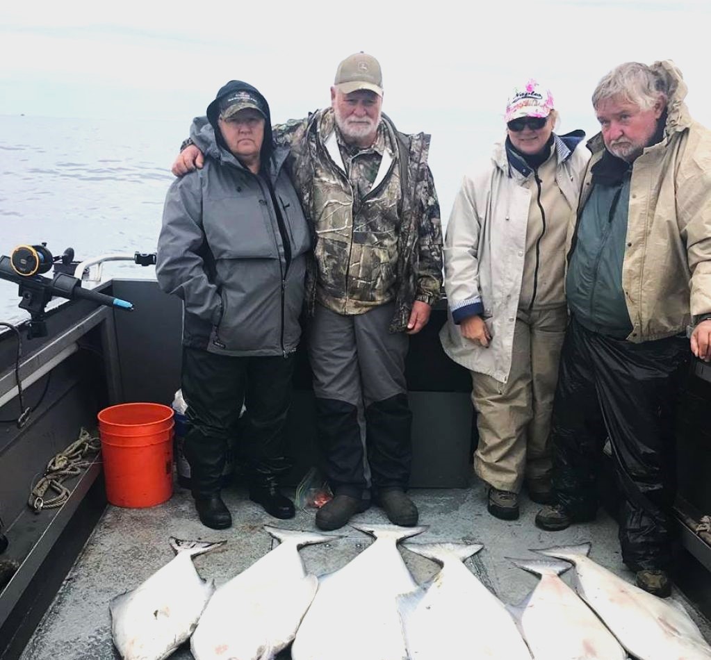 Four people enjoying a fishing tour in Homer, Alaska