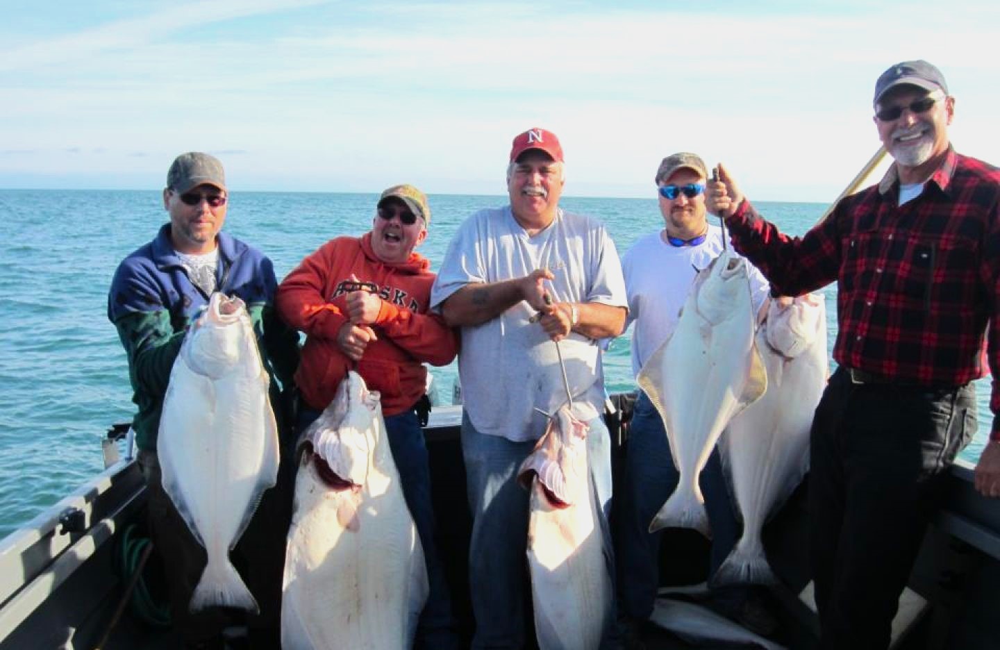 5 Pacific Halibut, each measuring 26 inches, caught on a fishing tour in Alaska