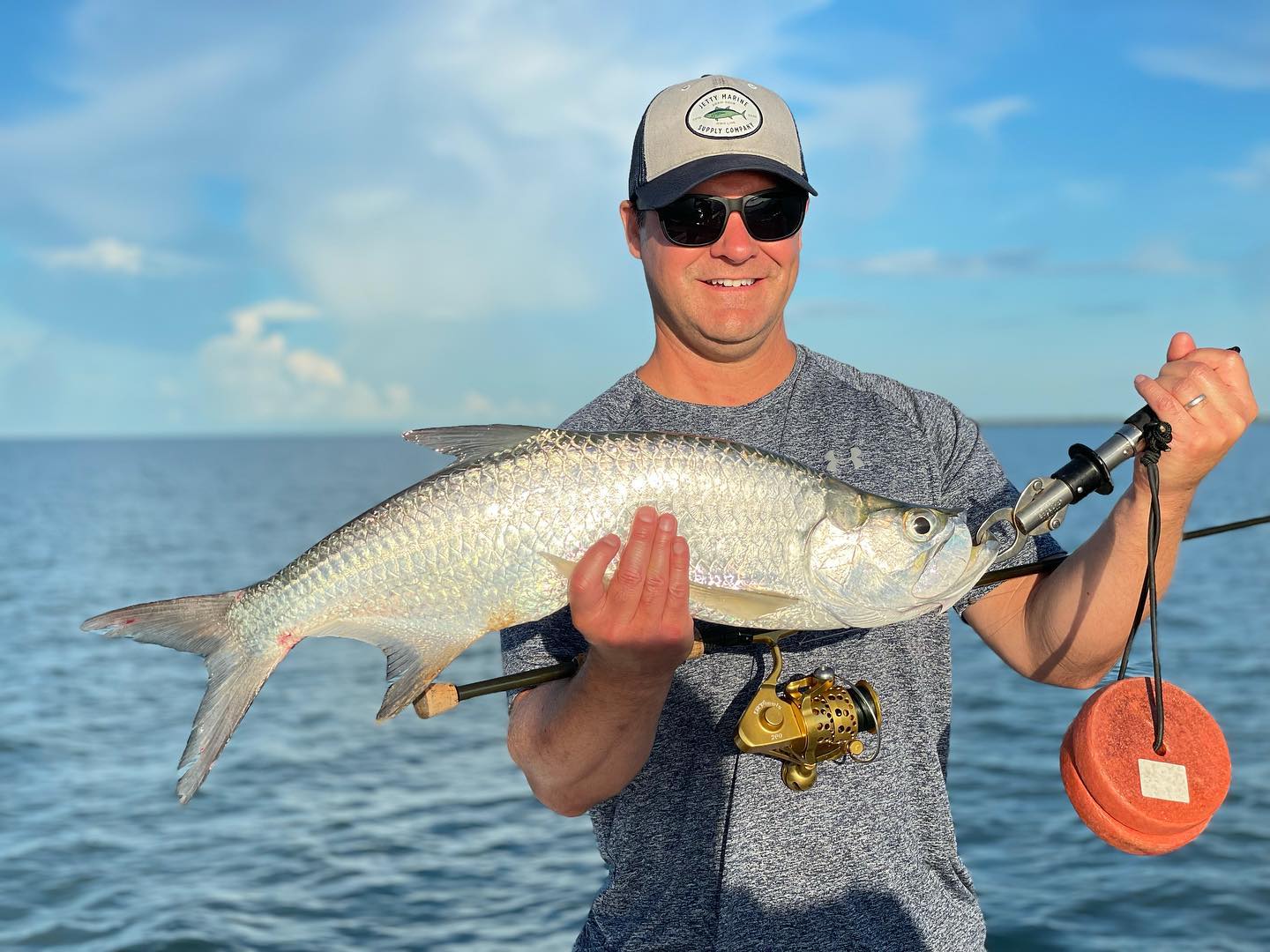 Angler with a tarpon fish in FL