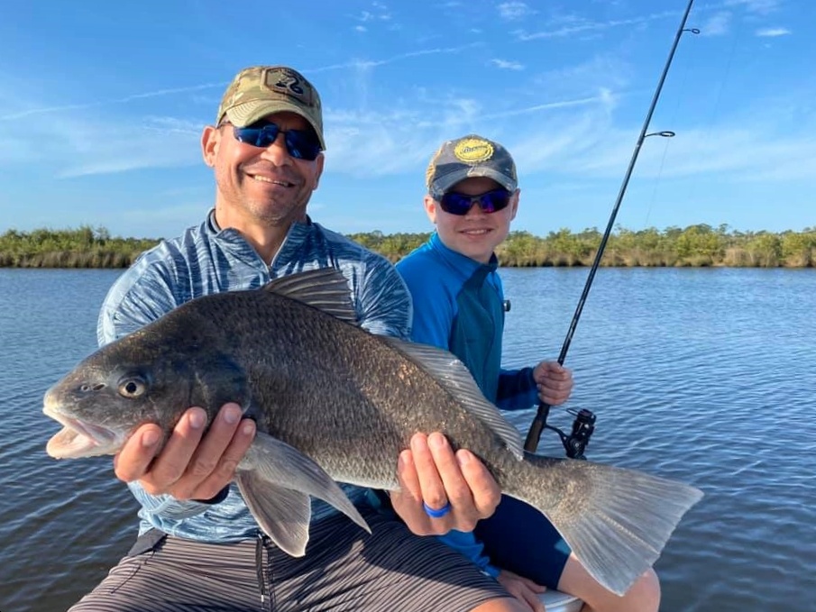 Photograph of a 31-inch black drum fish caught in FL