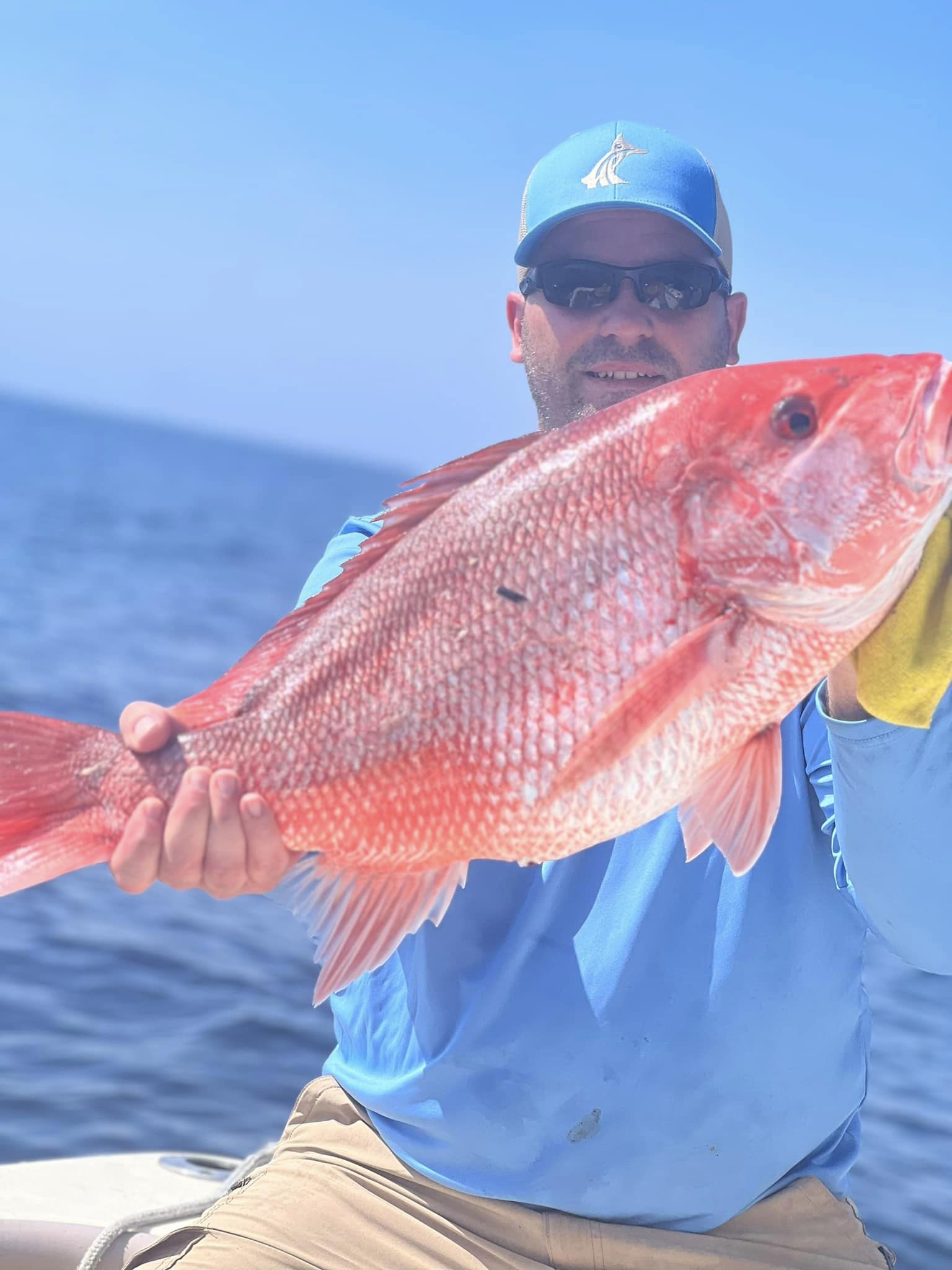 A fisherman catching a fish in Charleston