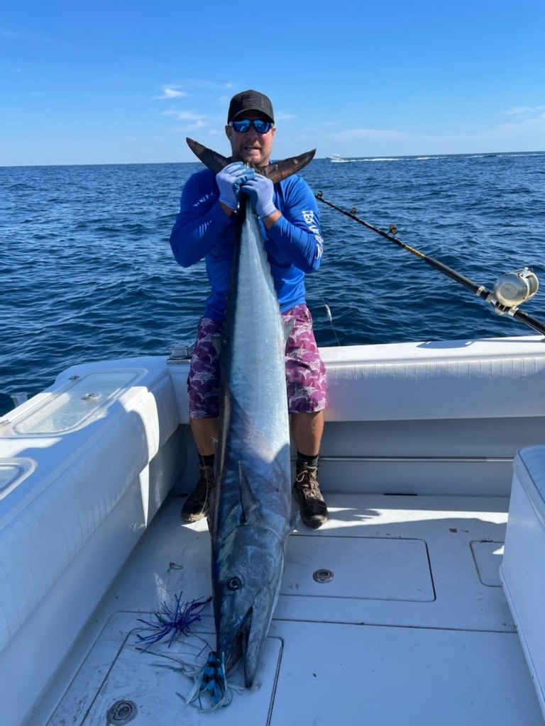 Angler holding a 49-inch fish in Murrells Inlet