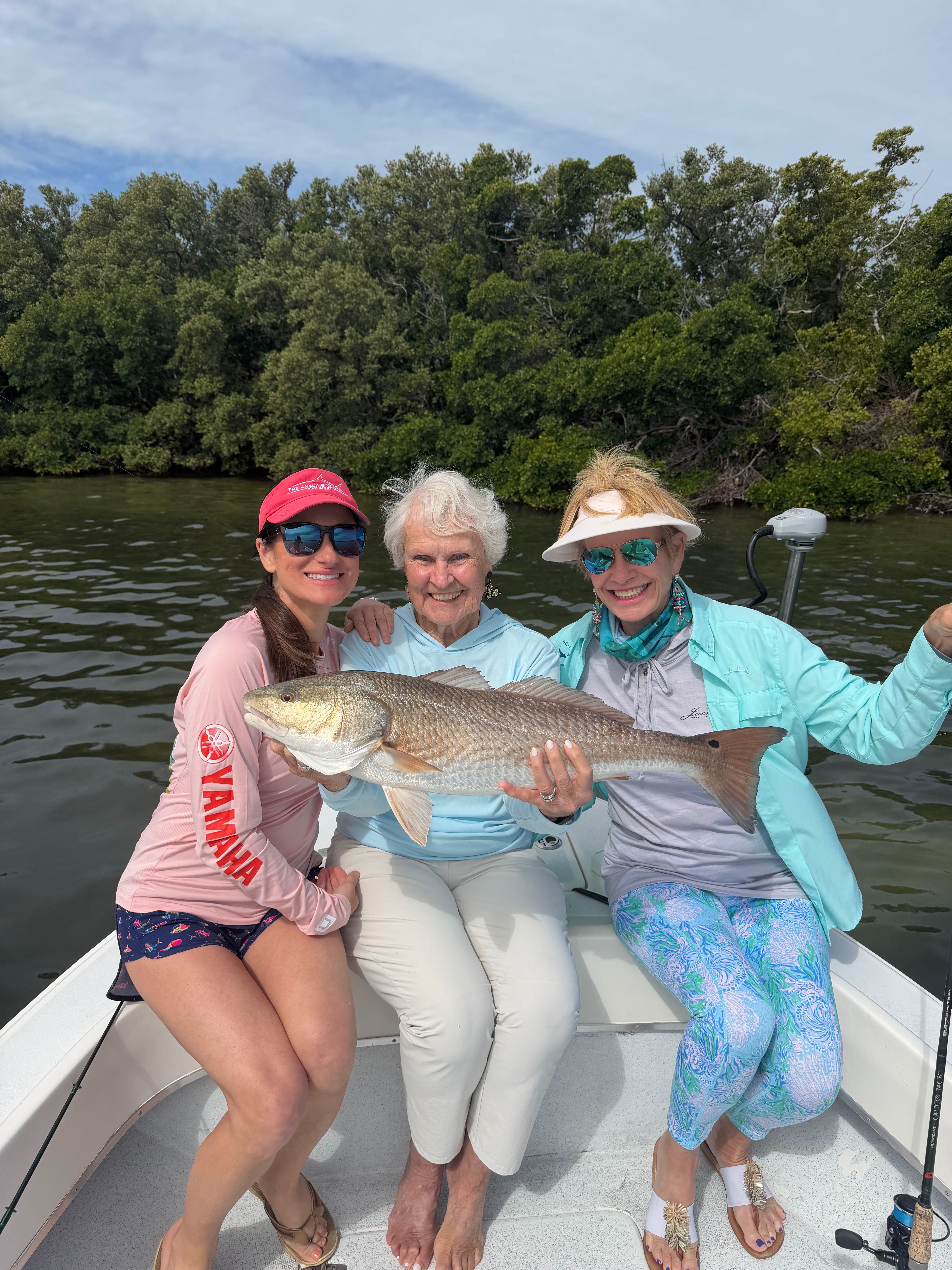 Inshore fishing boat in shallow waters targeting redfish, speckled trout, and snook