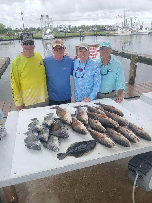 Fresh caught fish displayed on cleaning table at marina dock in Barataria LA
