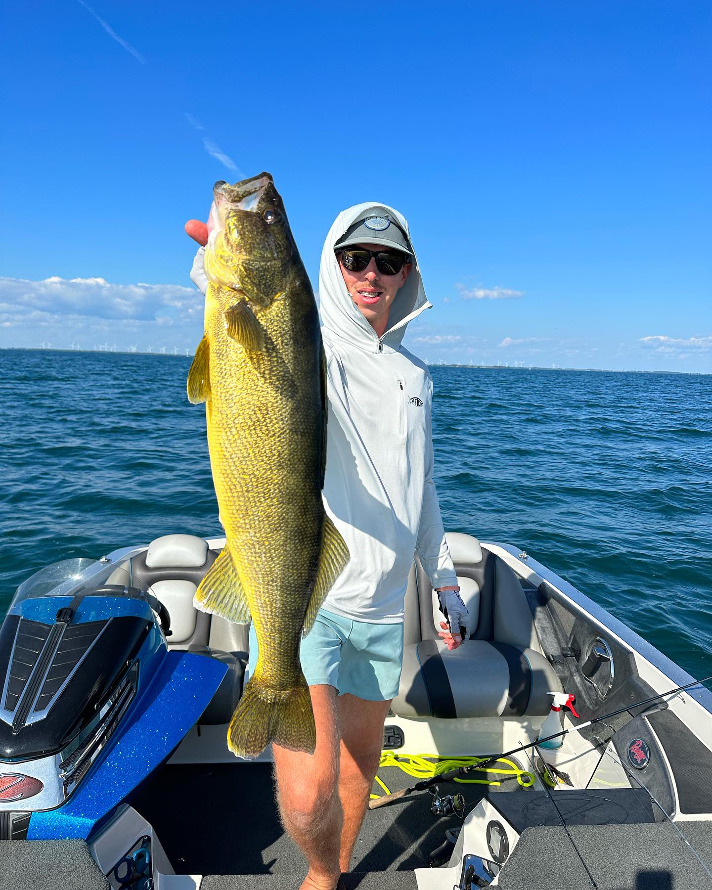 Angler holding a trophy-sized walleye in New York