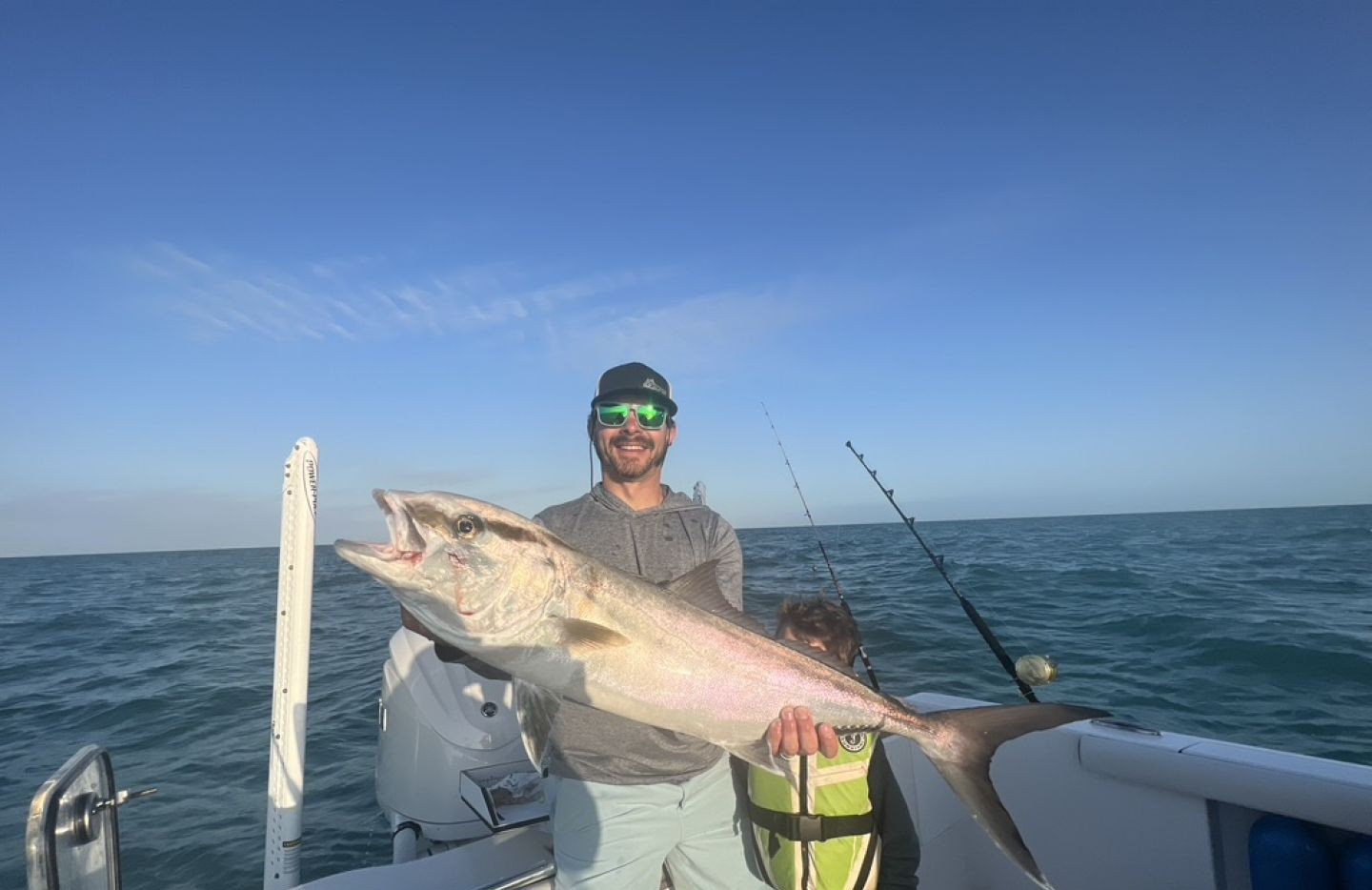 A person fishing in the waters of FL