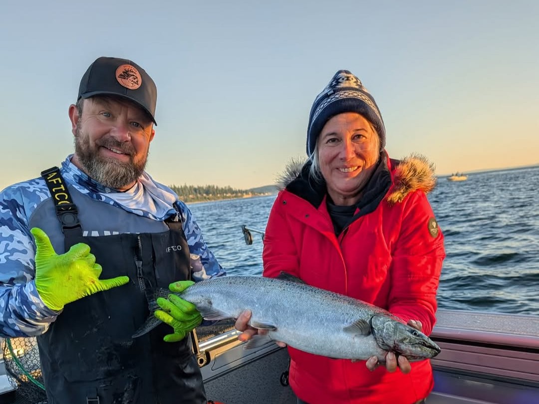 Coho salmon fishing charter boat departing Edmonds Marina, Puget Sound, Washington