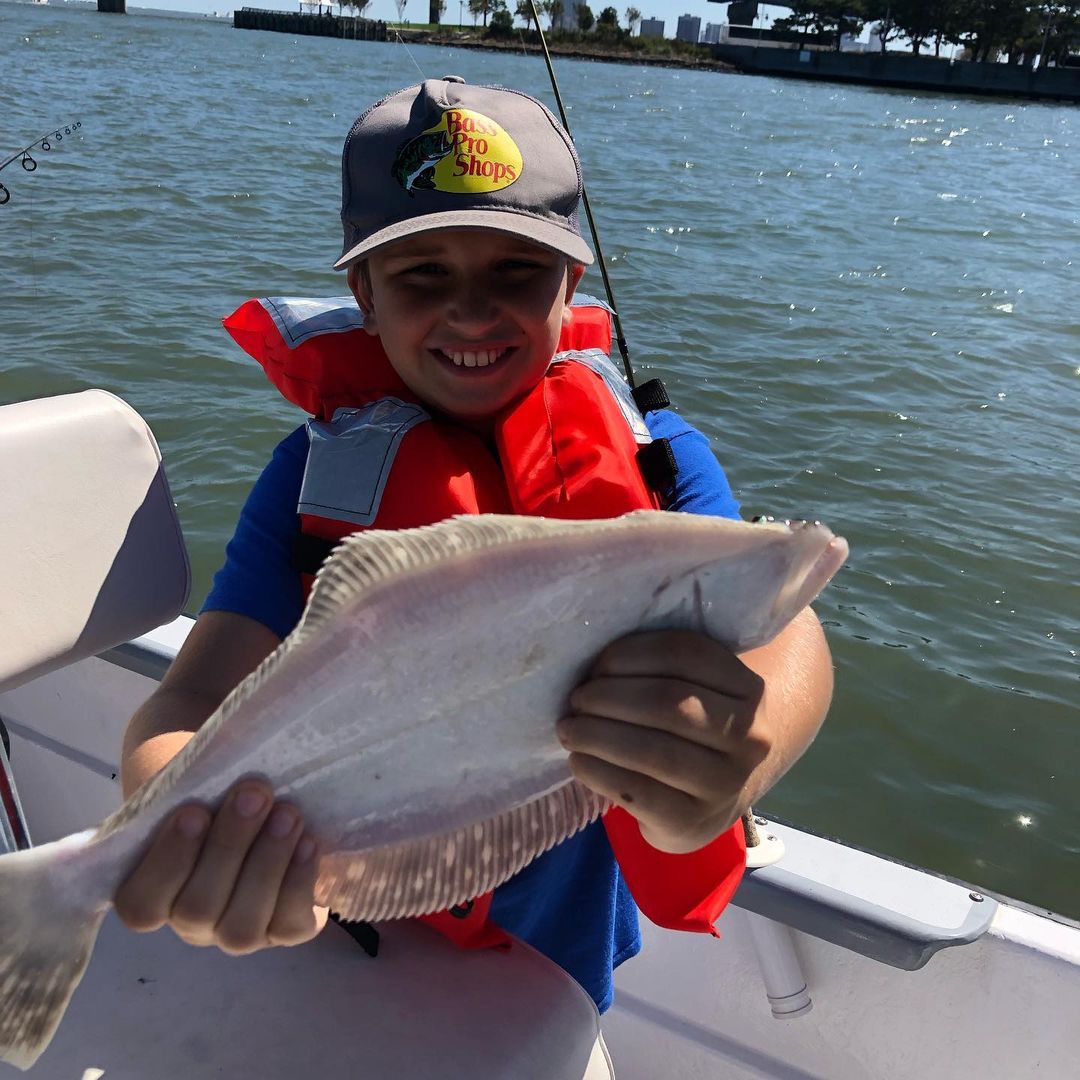 Angler with NJ fishing catch