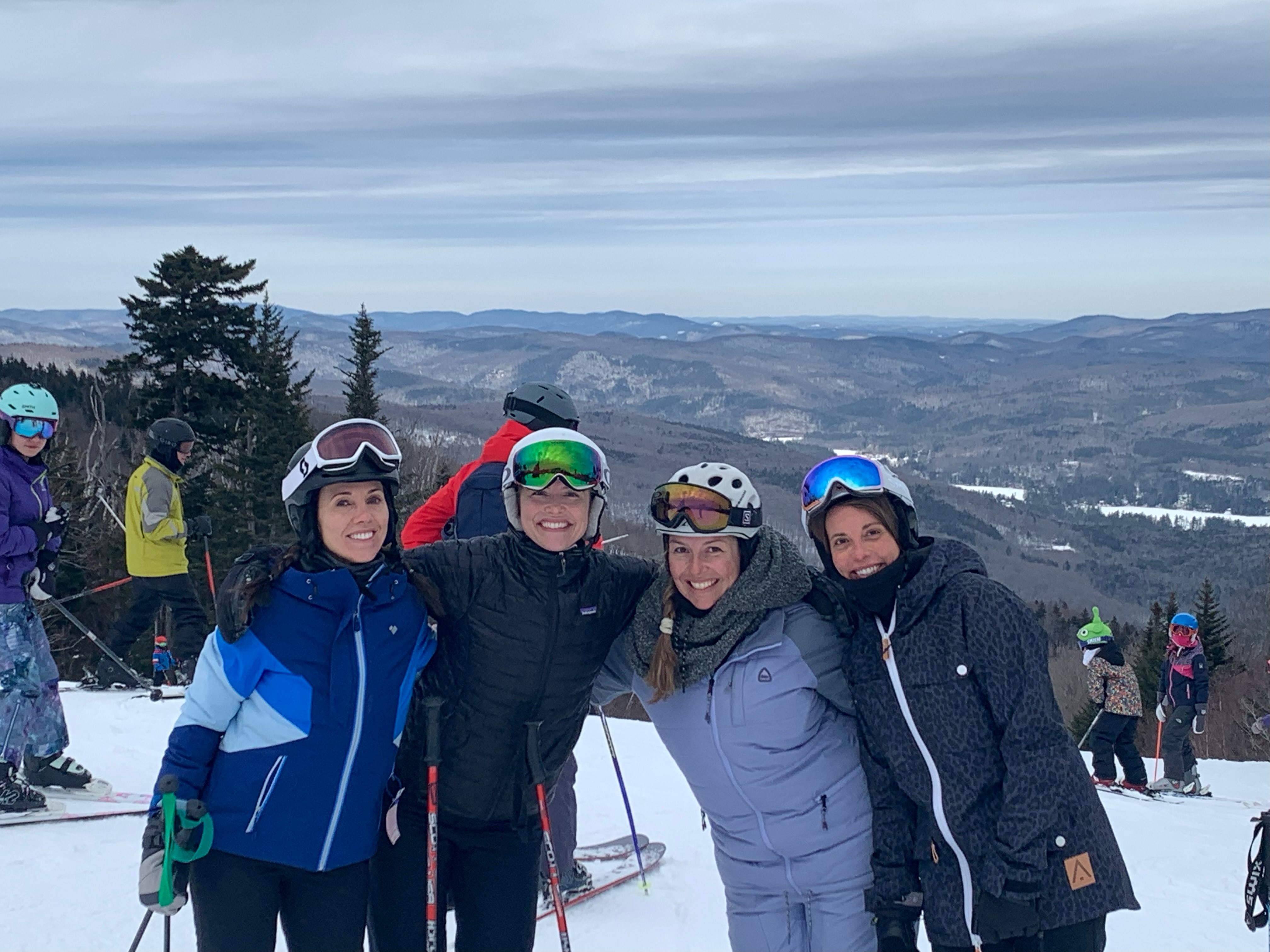 Group of 6 people enjoying snow sports in New York