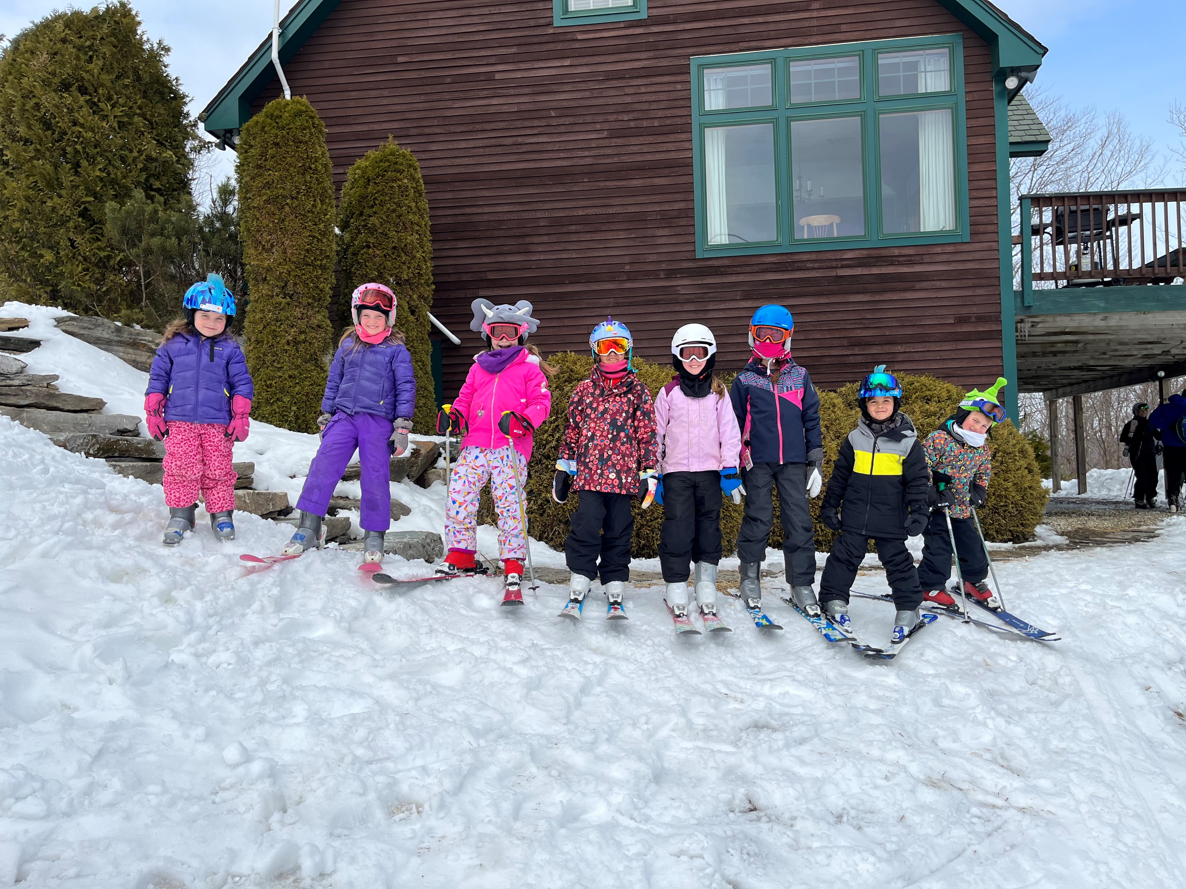 Eight people enjoying a snow sports adventure in Orchard Park