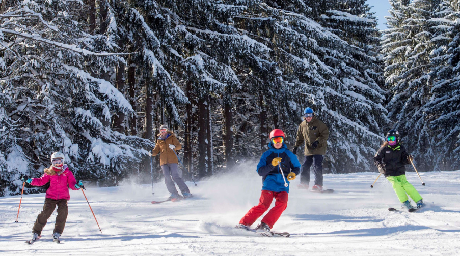 Two people enjoying snow sports in New York