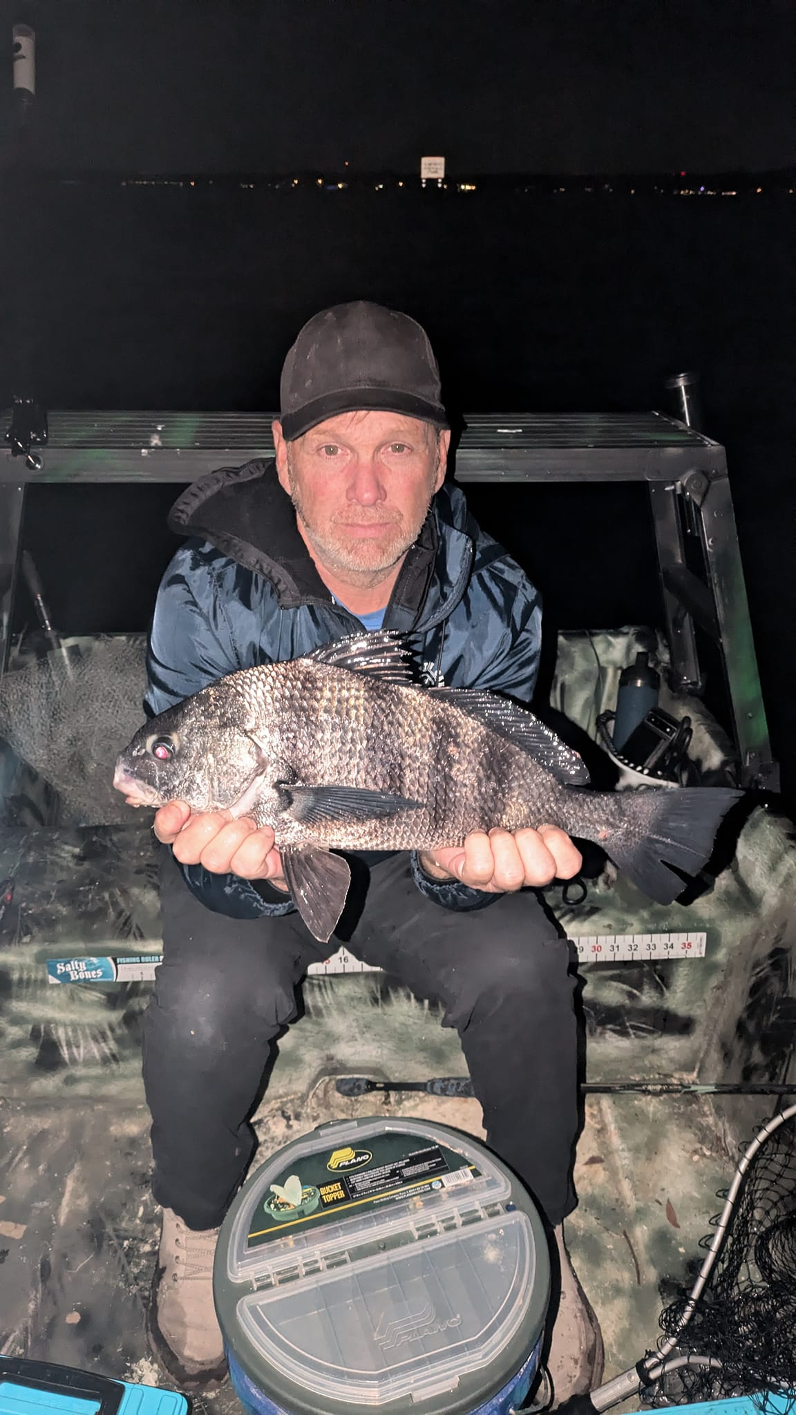 A person fishing for a black drum fish in Jacksonville