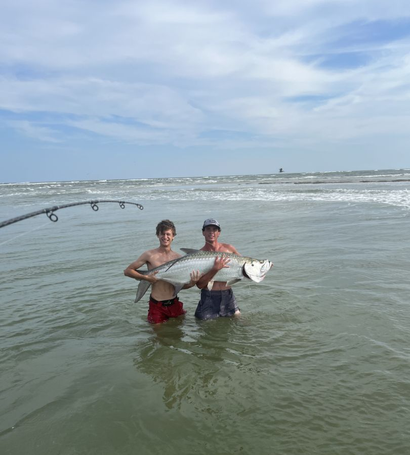 Tarpon fish caught by two people fishing in Savannah