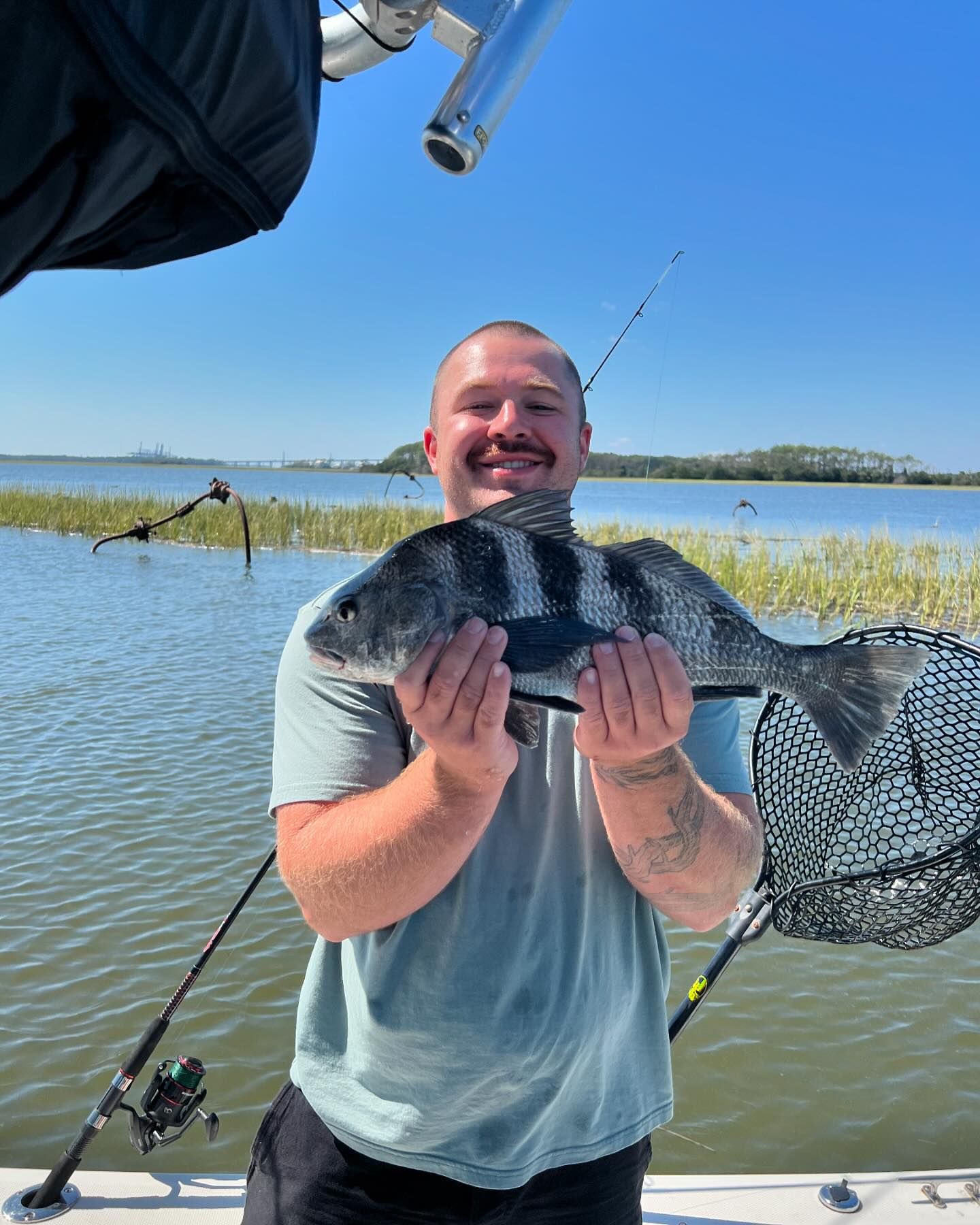 Angler with a large black drum fish in Mount Pleasant