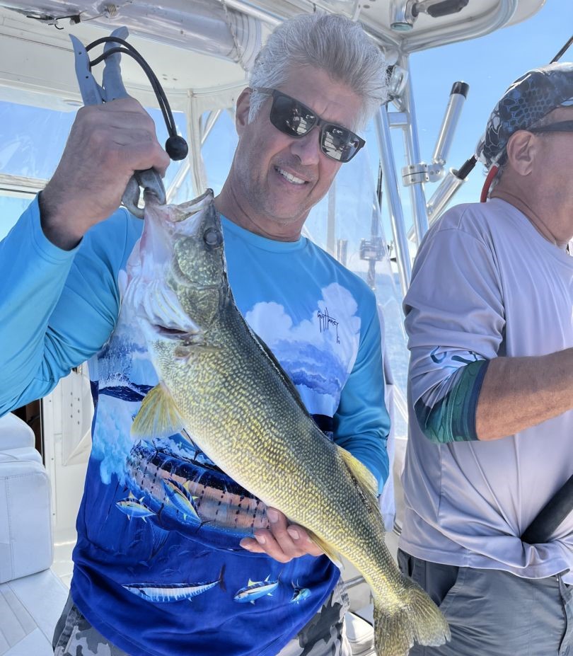 Walleye catch from Buffalo NY fishing trip held on boat deck