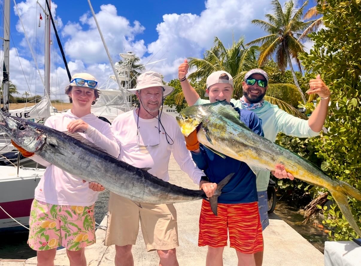 Two large fish caught during fishing trip in Christiansted St. Croix - Mahi Mahi and Wahoo Fish displayed at marina
