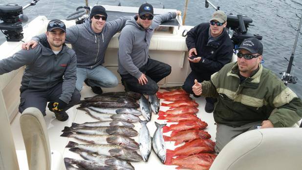 Five people enjoying fishing in Ucluelet