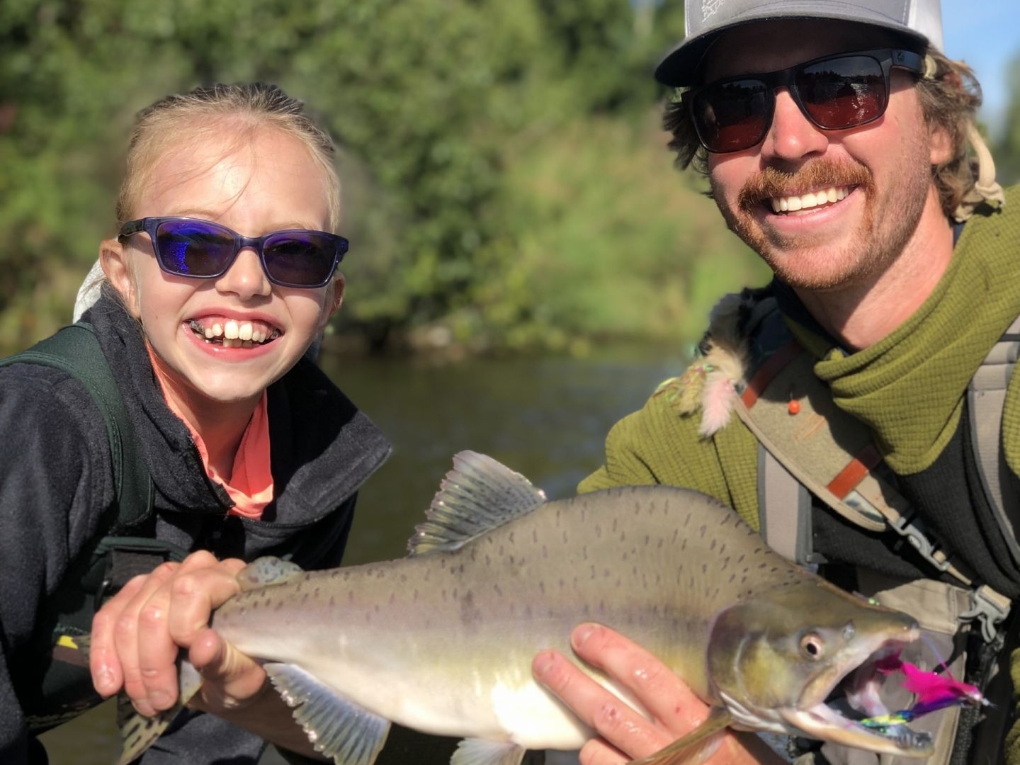 A single pink salmon being caught while fishing in Alaska