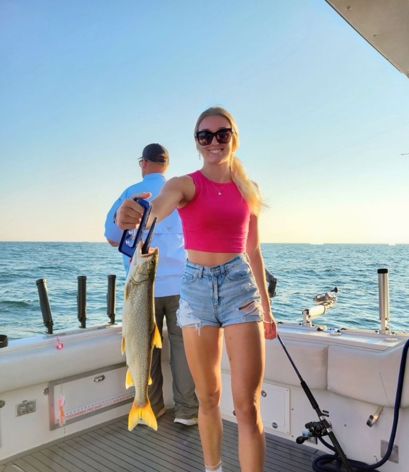 A fisherman holding a 22-inch catch at South Haven.