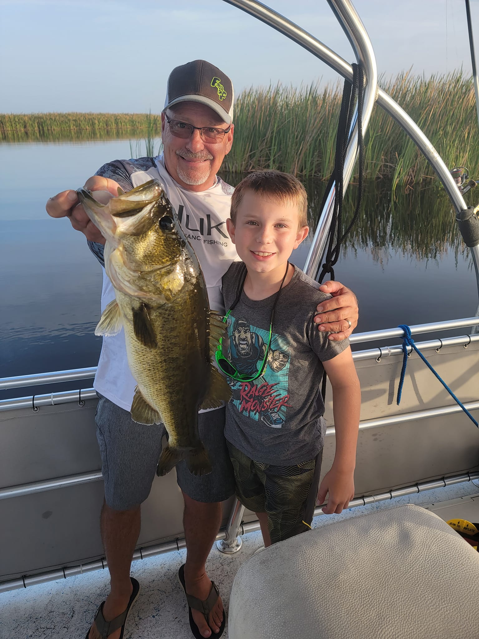 Four people fishing for a large largemouth bass in Fellsmere