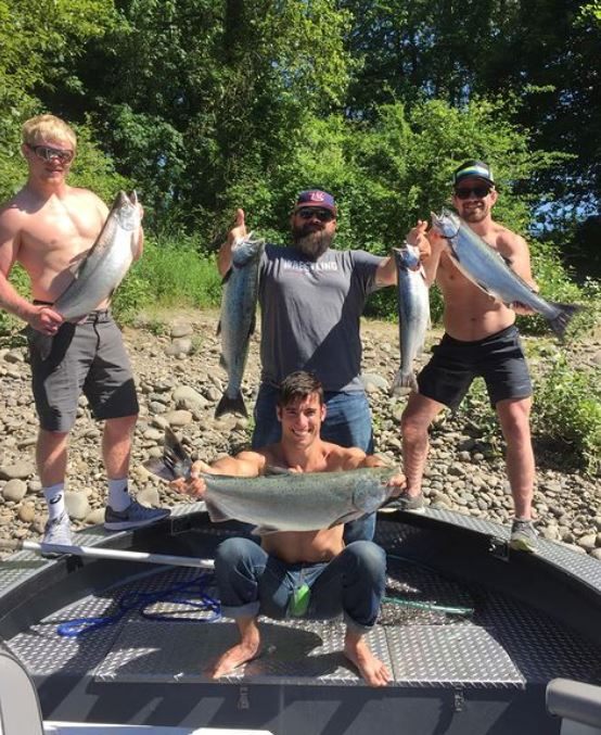 4 great fishermen stand with their catch in Oregon