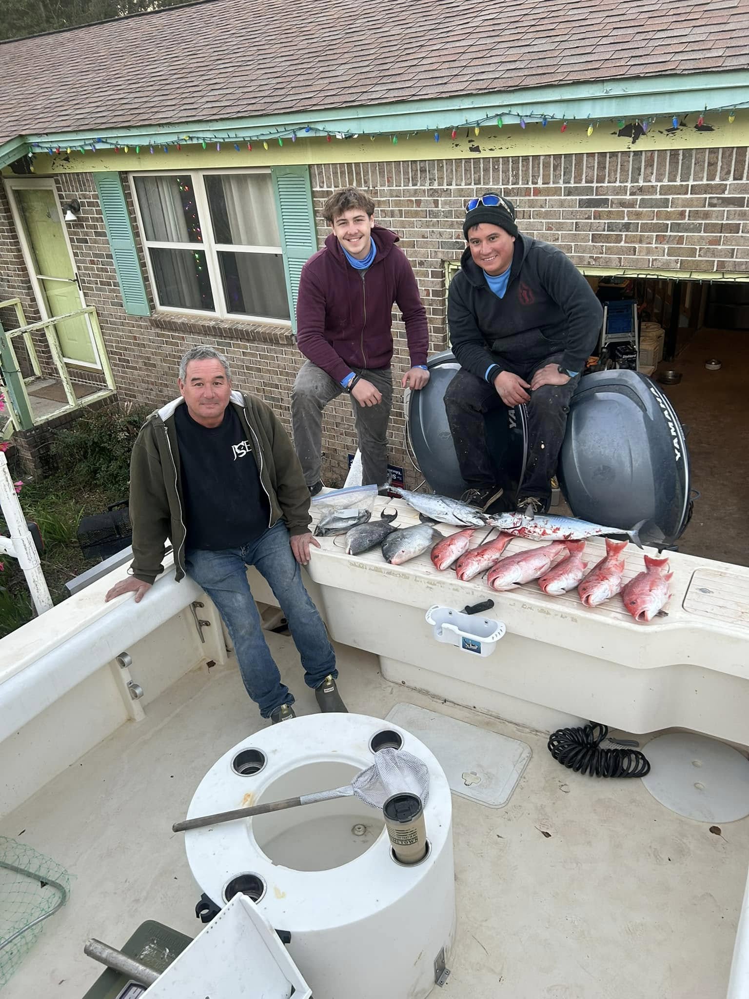 Successful fishing trip with fresh caught fish displayed on boat at Pensacola Beach FL