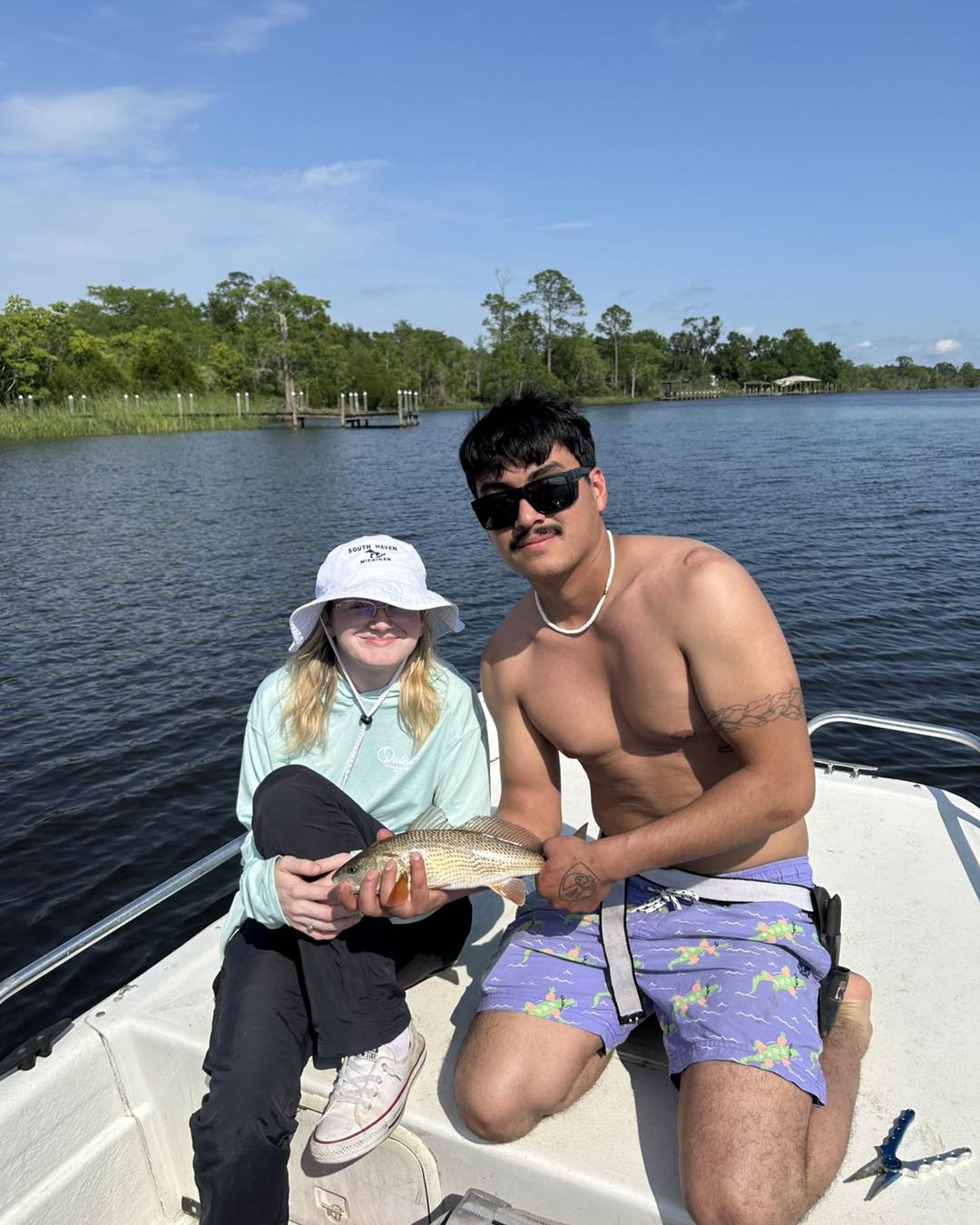 Successful redfish catch on boat in Pensacola Beach FL waters
