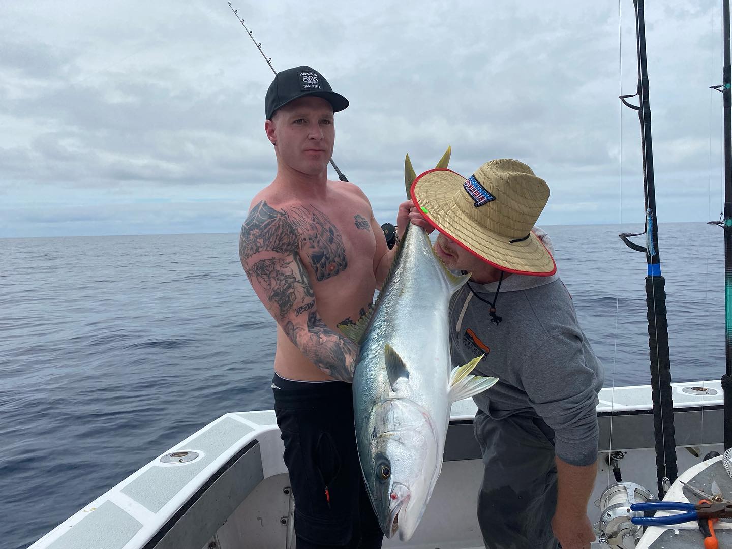 A fisherman with a 24-inch greater amberjack in San Diego