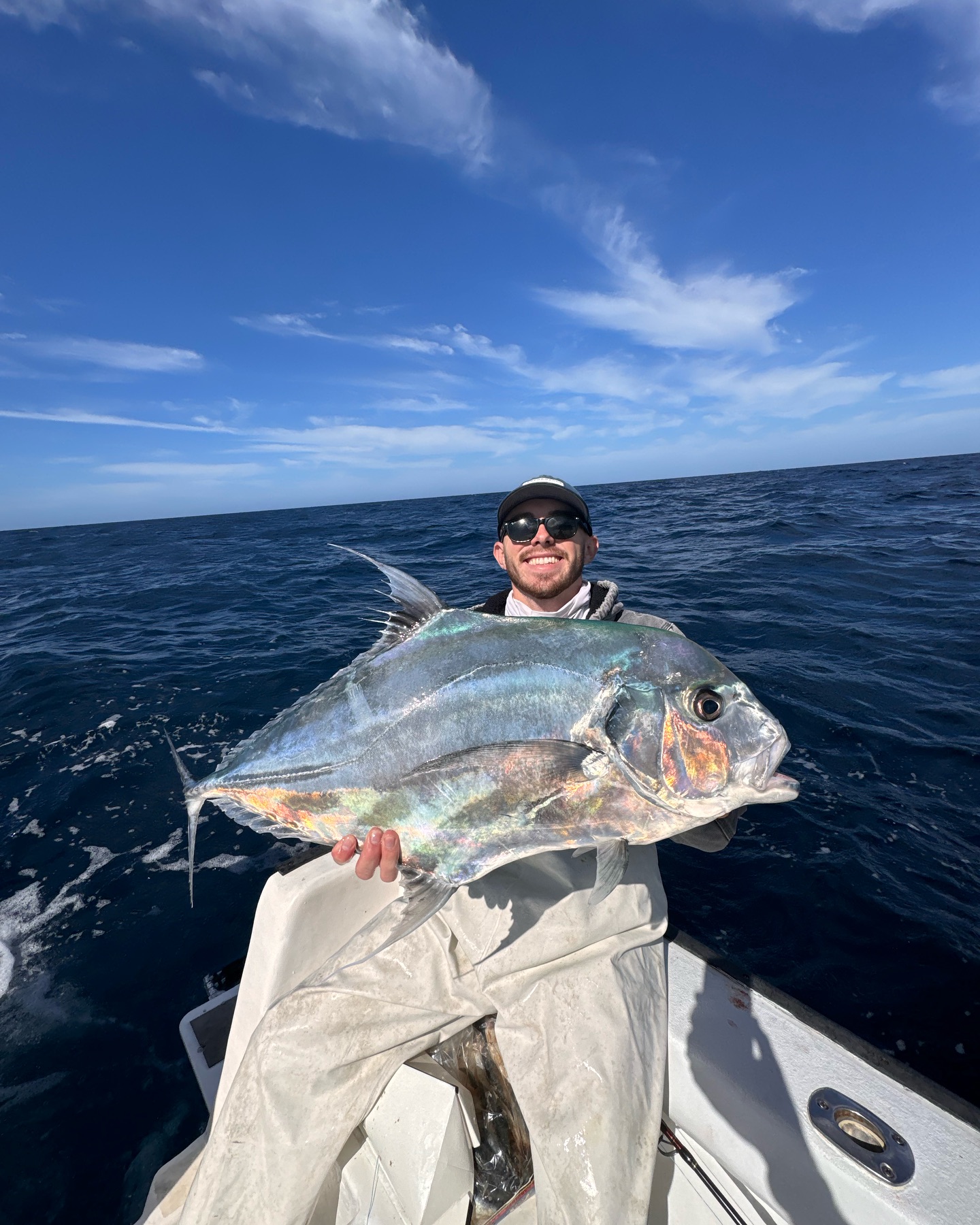 A fisherman catching an African Pompano in Clearwater.