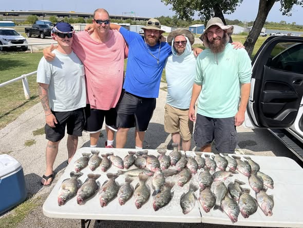 Fresh catch of fish displayed on table after successful fishing trip in Lewisville TX