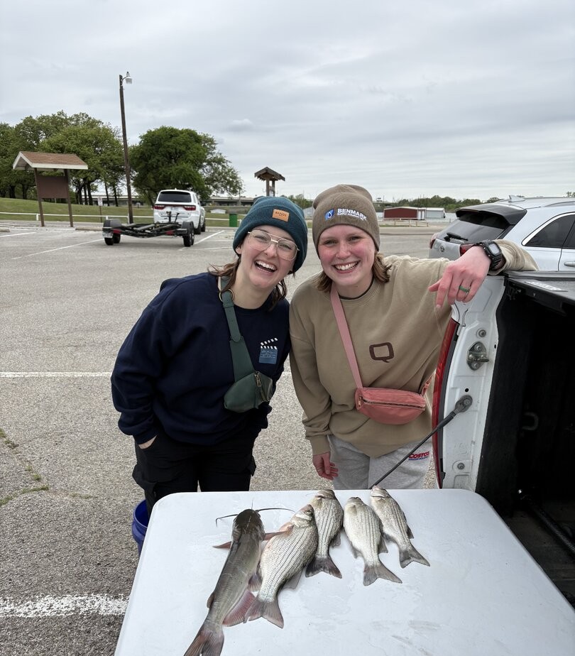 Fresh caught white catfish and white bass displayed on cleaning table at Lewisville TX fishing spot