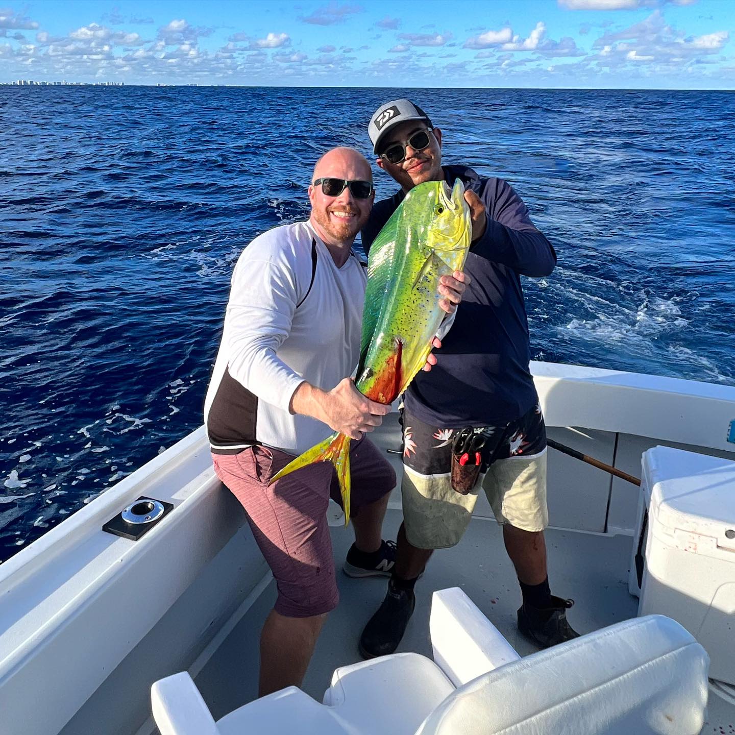 Fisherman holding large fish in Pompano Beach