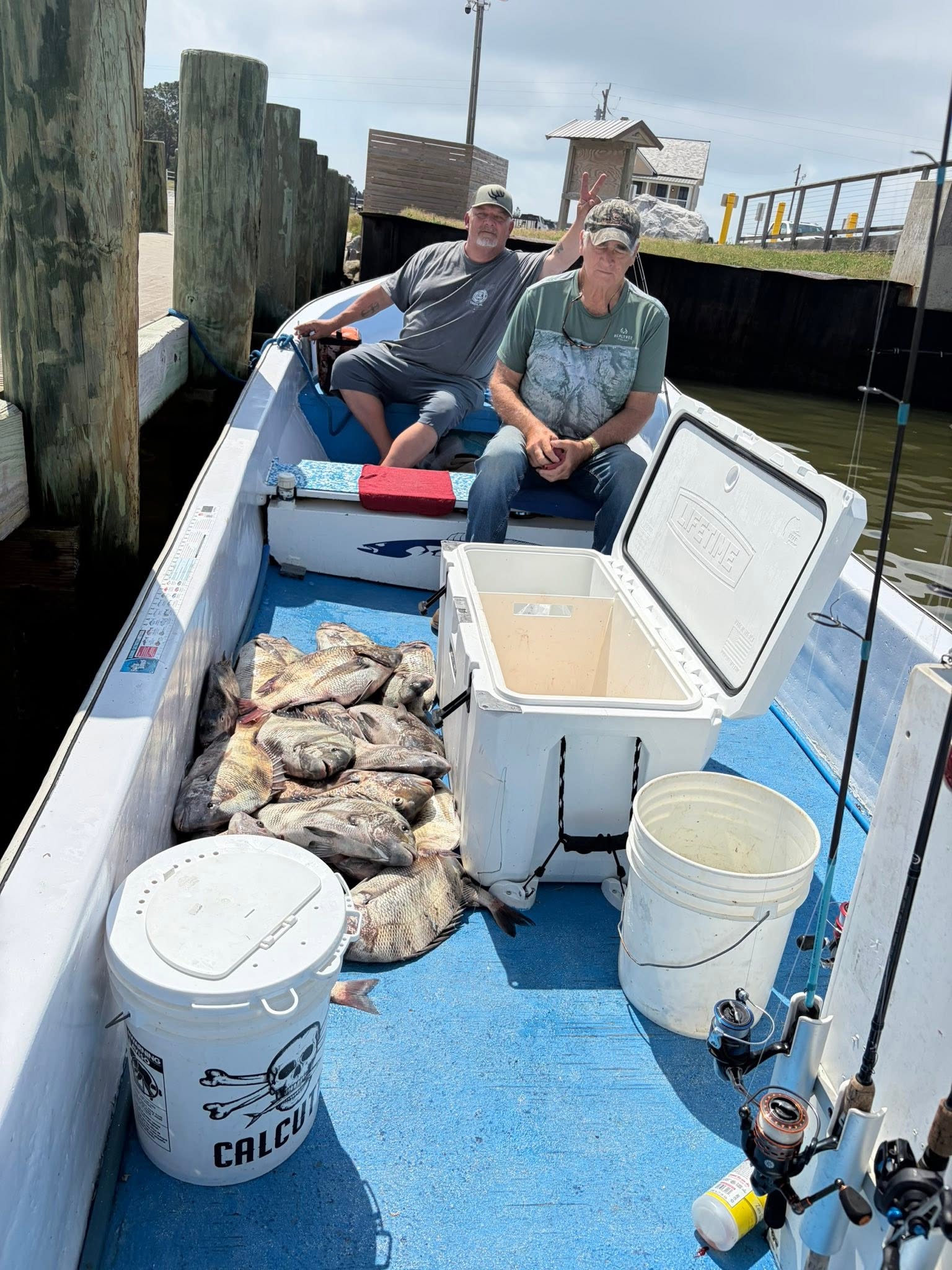 Fishing boat with large catch of fish on deck at Gulf Shores AL marina