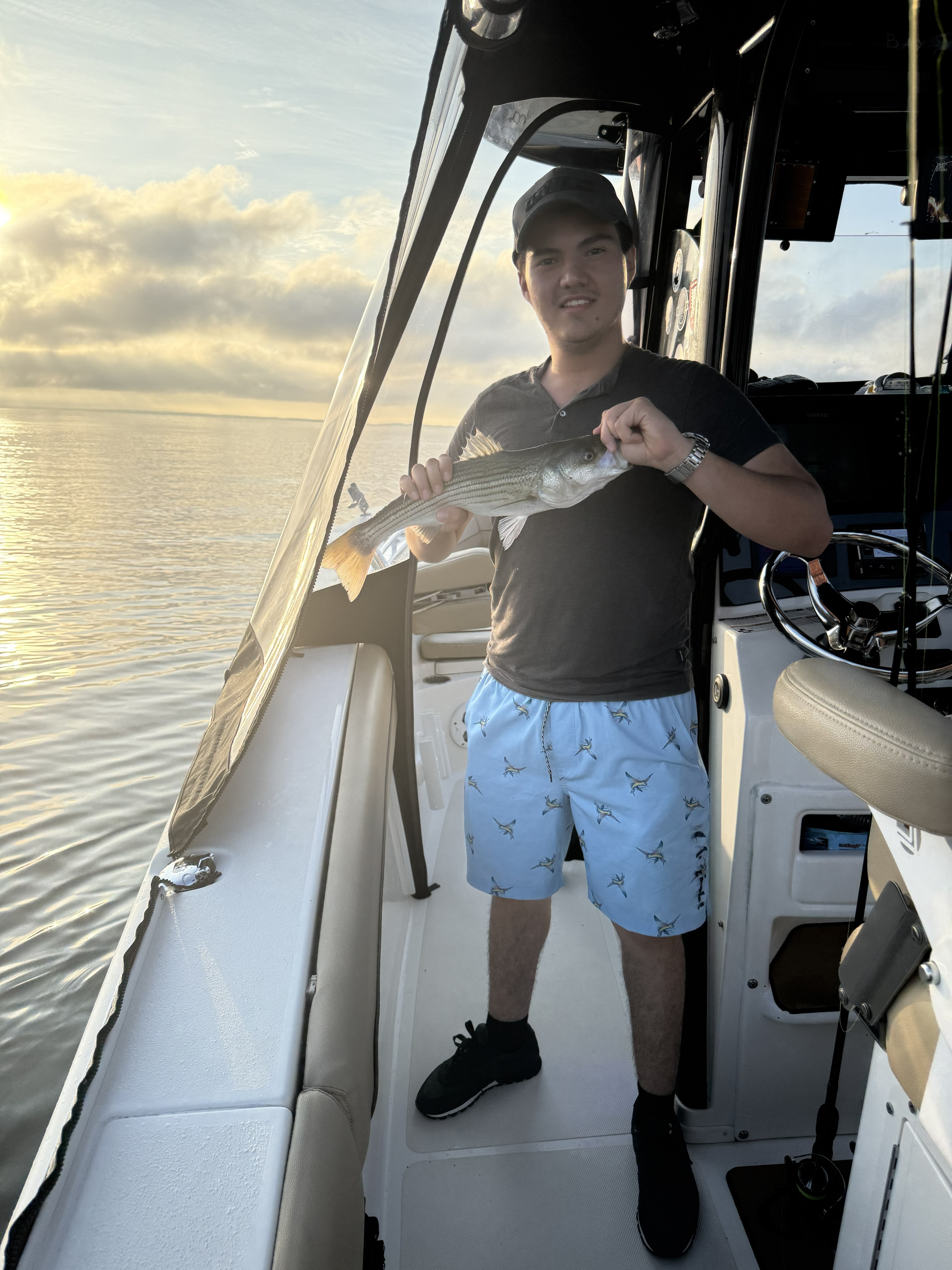 Striped bass caught while fishing in Pasadena MD waters from boat deck