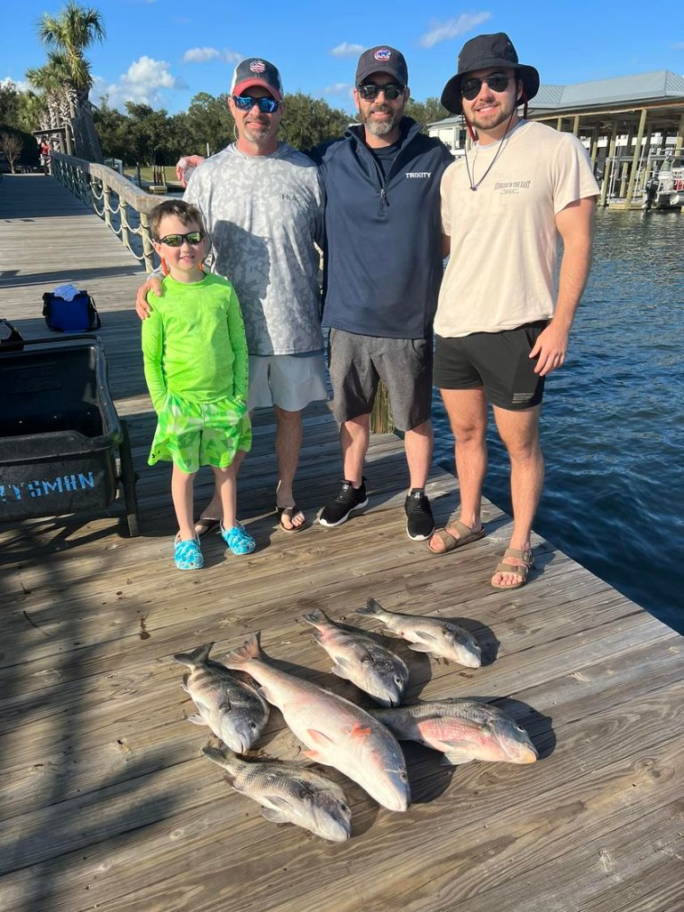 4 people fishing at Orange Beach