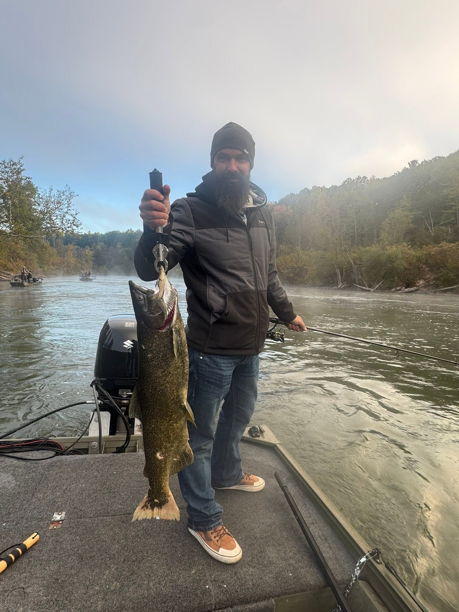 Chinook salmon caught while fishing in Brethren MI on boat with outboard motor