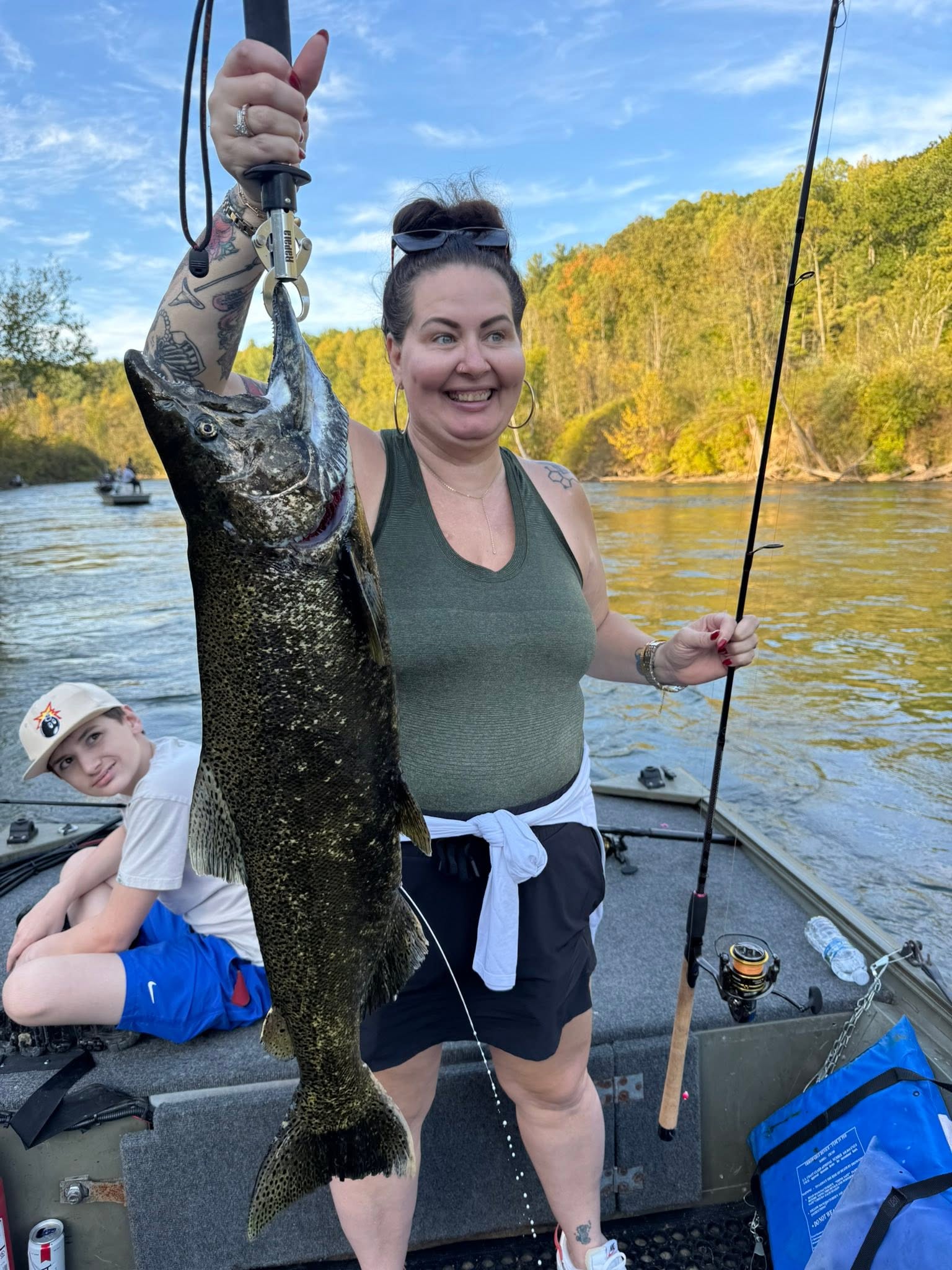 Large Chinook salmon caught fishing in Brethren MI displayed on boat deck
