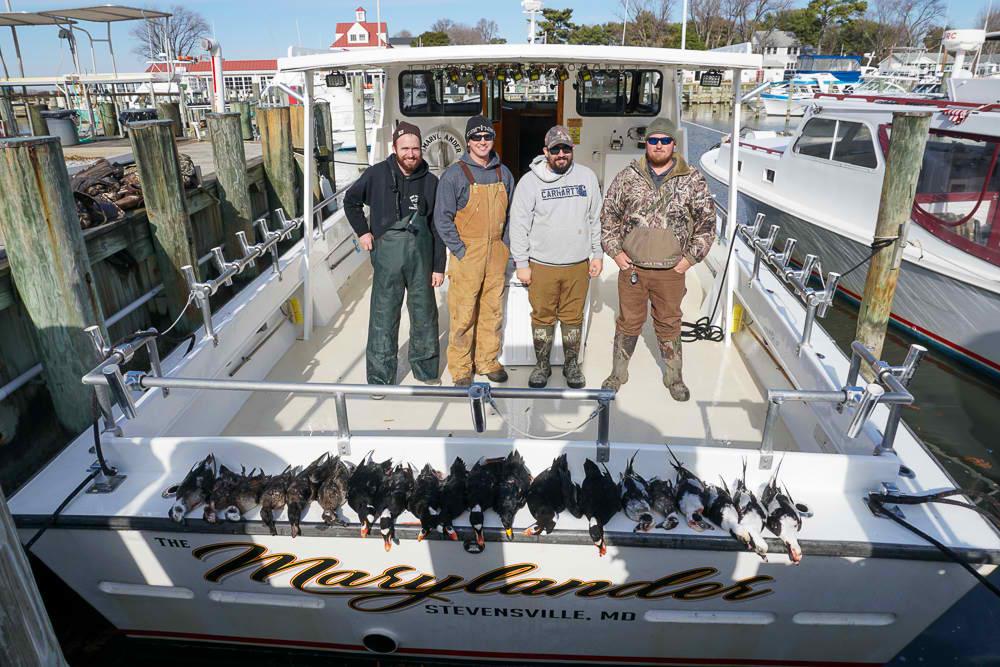 Five people enjoying a fishing trip in Stevensville