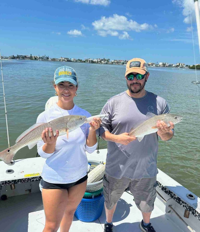 Two redfish caught on fishing boat in Bay Pines FL waters