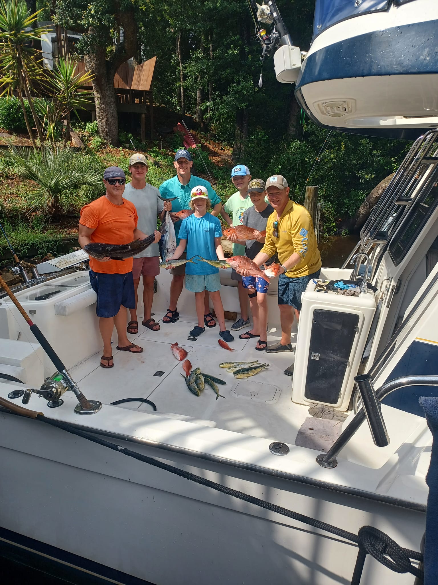 Successful fishing charter displaying fresh caught Little Tunny on boat deck in Fort Walton Beach FL