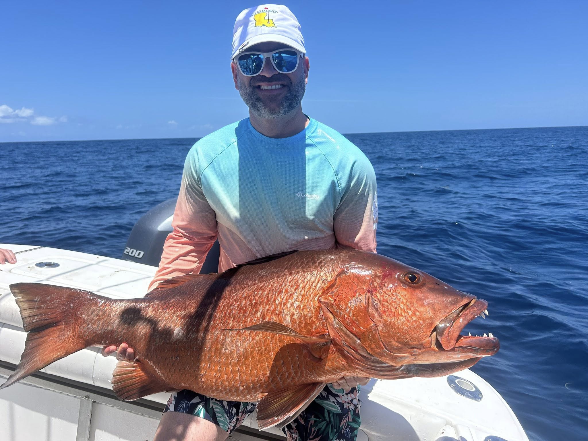 An angler with a large fish in Rincón