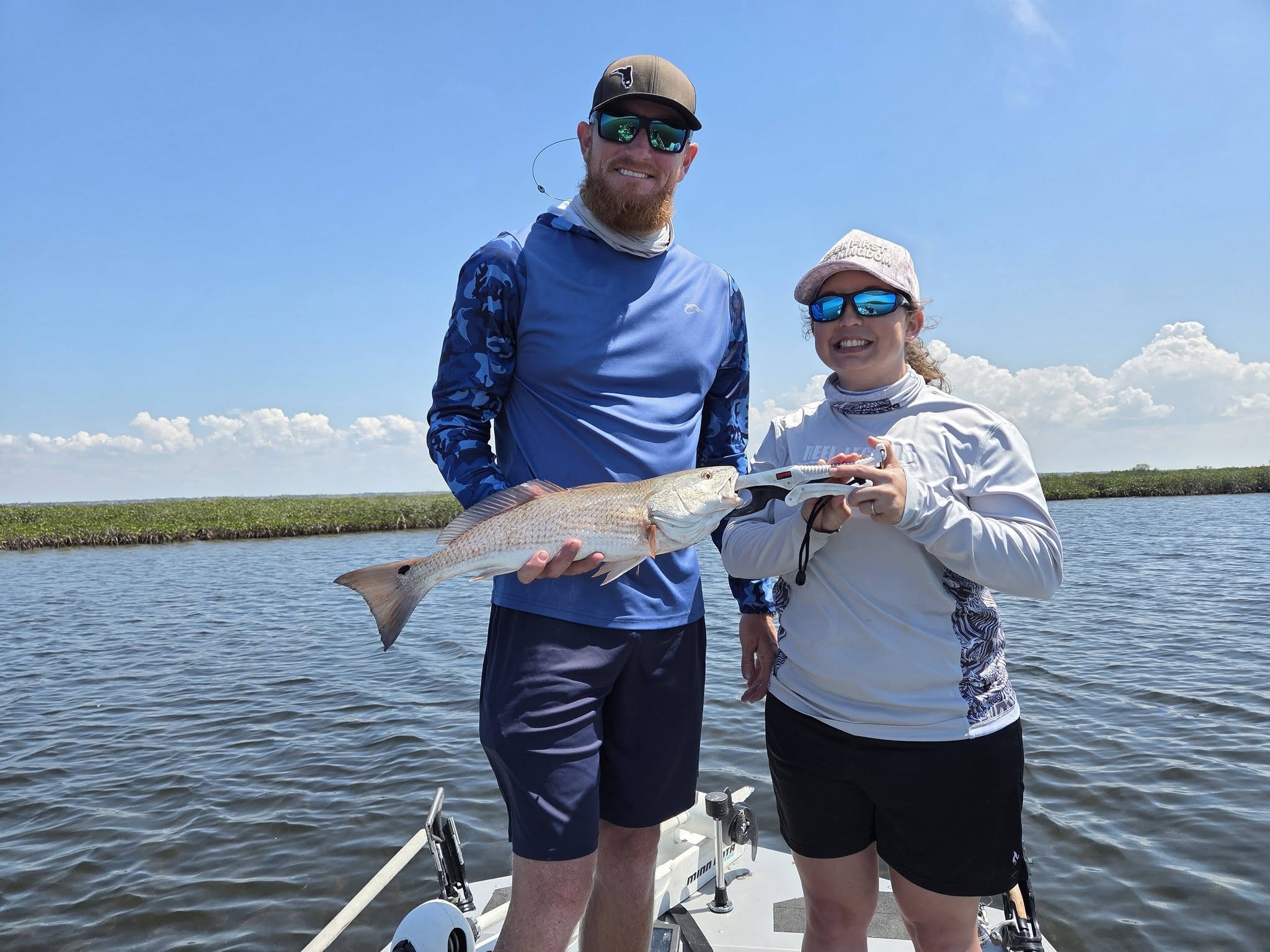 Successful redfish catch on fishing boat in Bayport FL waters