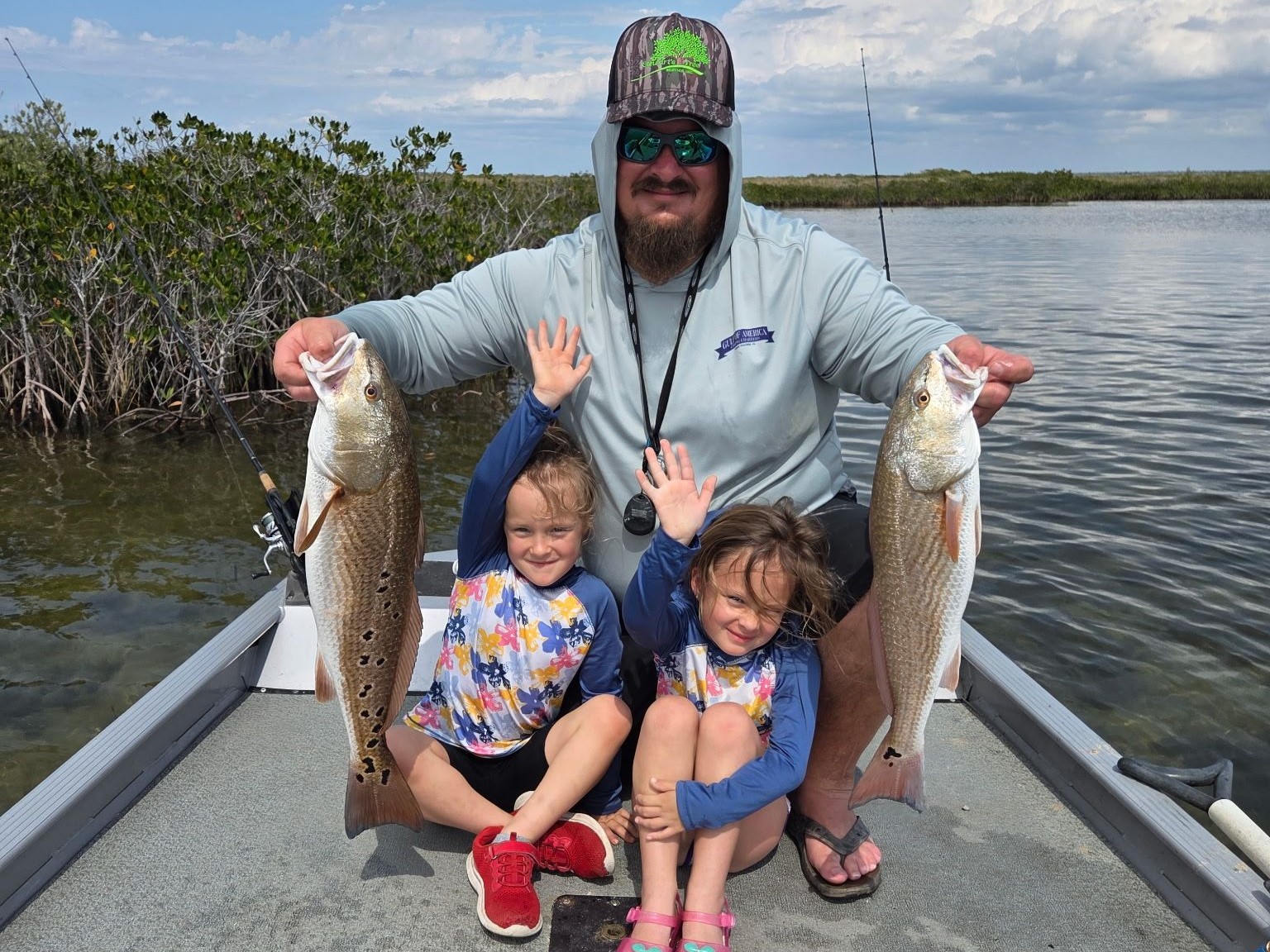 Family inshore fishing charter boat Dek Kat targeting redfish snook speckled trout