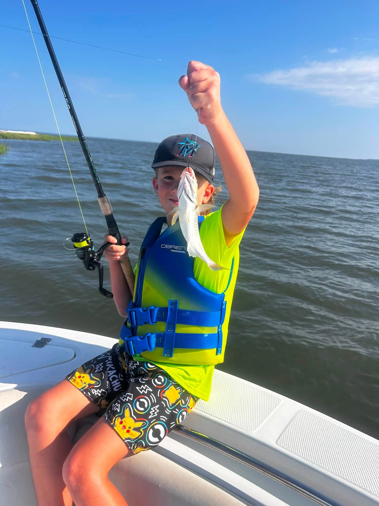 Successful fishing catch displaying small fish on boat in Midway GA waters