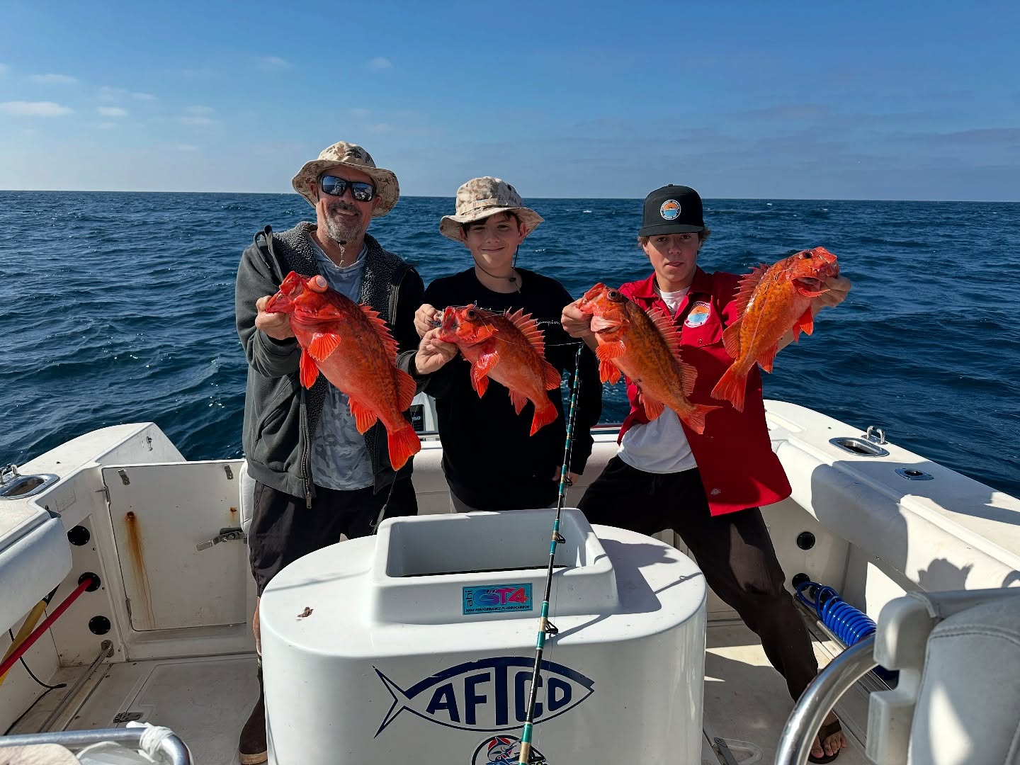 Three anglers fishing on the coast of California