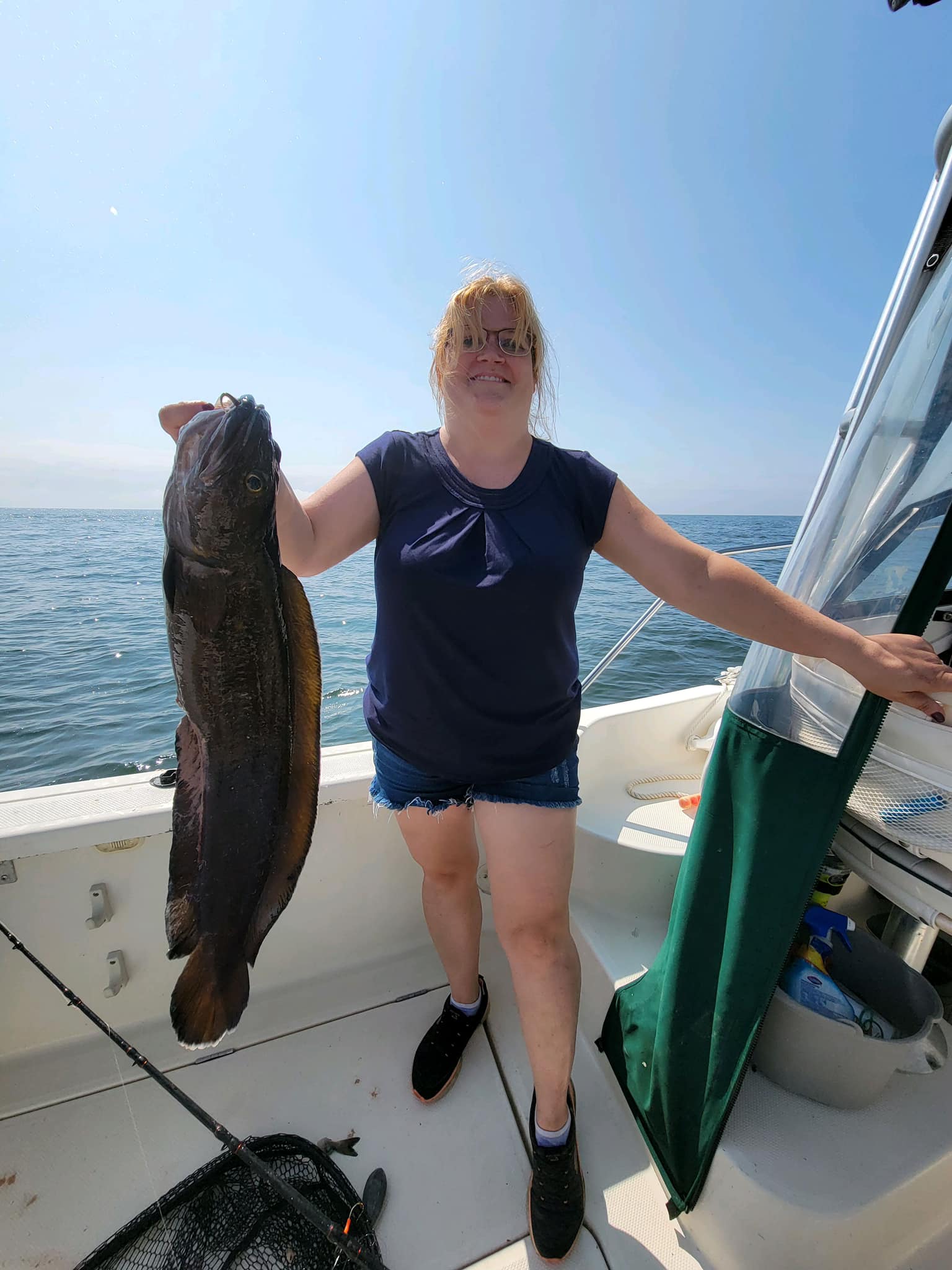 A person fishing with a rod in Maine